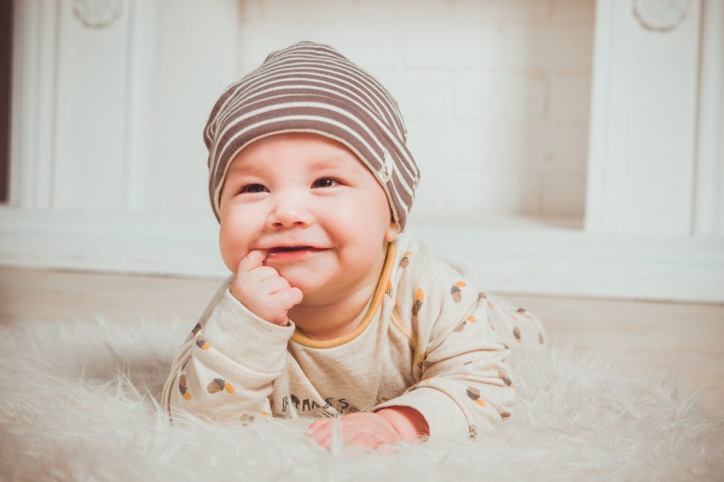 smiling-baby-biting-right-index-finger-1648374 Smiling Baby Biting Right Index Finger